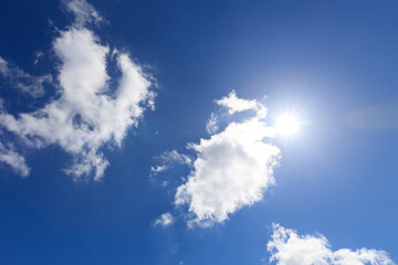 Poster - sun on blue sky with clouds in summer