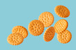 round cookie flying on a blue background, copy space