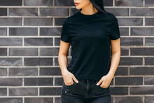 Stylish Brunette Asian Girl Wearing Black T-shirt Posing Against Street , Urban Clothing Style. Street Photography