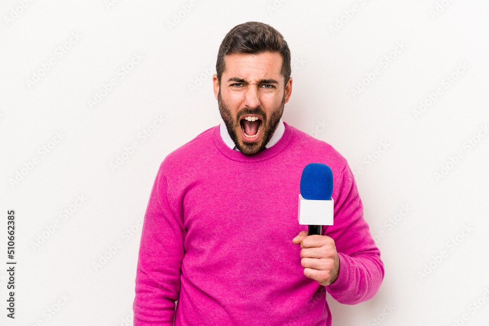 Young caucasian tv presenter man isolated on white background screaming ...