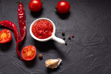 Canvas Print - Chilly pepper and tomato sauce ingredient for homemade cooking at table