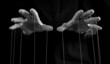 Man hands with strings on fingers. Negative abusive relationship, manipulation, control, power concept. Black and white. High quality photo