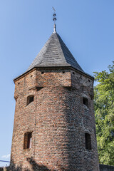 Picturesque medieval Monnikendam - water gate was built around 1420 as part of the second city wall from 1380 - 1451. The gate consists of two towers connected by an arch. Amersfoort, the Netherlands.