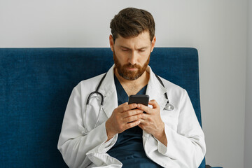 Wall Mural - Doctor therapist use phone during break in medicine office