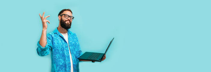young crazy bearded charismatic man. shocked or surprised expression. laptop concept. funny promotio