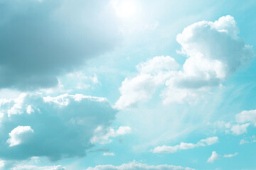 Wall Mural - sky.clouds and sunshine. white clouds and sun rays in a light blue sky.beautiful heavenly wallpaper 