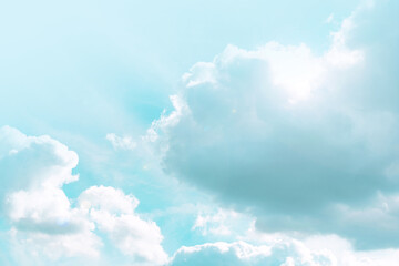 Wall Mural - heaven background. clouds and sunshine. white clouds and sun rays in a light blue sky.beautiful heav