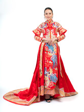 Portrait Of A Young Asian Chinese Female Lady Model Wearing Red Traditional Vintage Wedding Dress Costume Smiling And Posing With Different Poses And Gestures 