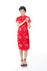 Wall Mural - Portrait of a young asian Chinese female lady model wearing red traditional vintage costume Cheongsam smiling and posing with different poses and gestures 
