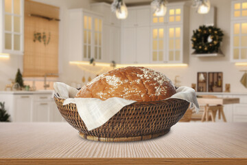 Sticker - Fresh bread in wicker basket on wooden table in kitchen