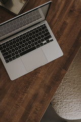 Wall Mural - Flatlay of laptop computer on solid wood table. Work at home, freelance, online shopping, blog, social media branding concept