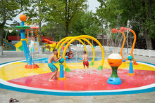 Children Playing In The Aqua Park