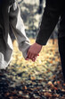 Close-up of a couple in love holding hands while walking. Selective focus, vertical.