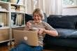 © cherryandbees - woman having video call talking to her friends, while eating breakfast