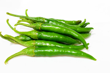 Fresh green chilli peppers isolated on white background