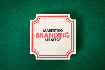 Wall Mural - marketing branding strategy. sheet of paper with text on a green background