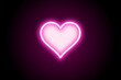 Neon pink glowing glowing heart icon on black background