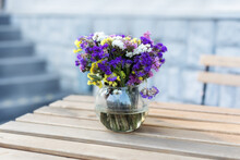 Bouquet Of Summer Flowers In Glass Vase On Table On Terrace. Fresh Field Flowers In Vase. Cozy Home Decor Of Patio Yard. Still Life. Women Day Or Wedding Concept. Festive Background, Copy Space