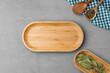 Empty wooden plate on kitchen table, top view