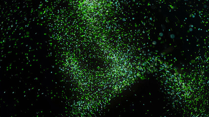 Poster - Rotating stream of colorful dust on black background. Animation. Beautiful sequins fly in swirling streams from transparent figure on black background. Dust swirl moves like mixer