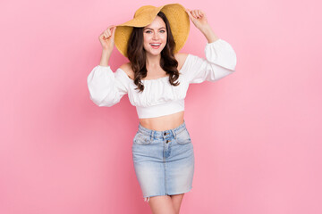 Poster - Photo of young charming girlish stunning female relaxing summer vacation wear straw hat isolated on pink color background