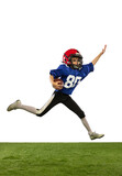 Fototapeta Sport - Athletic kid, beginner american football player in sports uniform and helmet training isolated on white background. Concept of sport, challenges, motion, achievements.