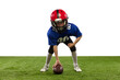 © master1305 - Athletic kid, beginner american football player in sports uniform and helmet training isolated on white background. Concept of sport, challenges, motion, achievements.