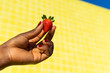 © ADDICTIVE STOCK - Black woman holding strawberry