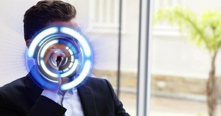 Poster - Animation of processing circle over caucasian businessman using smartphone in office
