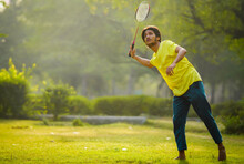 Badminton Playing In The Park.