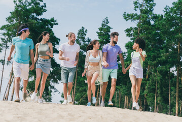 Sticker - Full size of cheerful carefree people hold hands running sand beach spend weekend nature outdoors