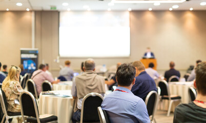 Wall Mural - business speaker giving a talk at business conference event.