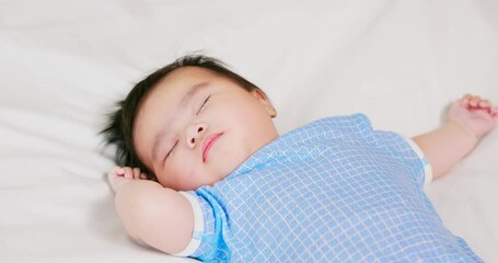 Poster - baby sleeping on the bed