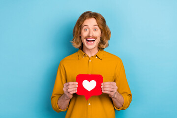 Canvas Print - Portrait of attractive cheerful long-haired guy holding in hand like card yes having fun isolated over bright blue color background