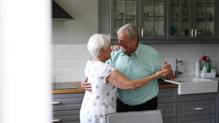 Wall Mural - Senior Couple Dancing in their Kitchen
