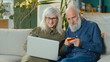 © alex_marina - Excited Happy Elderly Couple Shopping Online From Home Using Computer and Credit Card. Online Shopping, Selection of Goods for Ordering on the Internet. Modern Technologies and Retirement Concept.