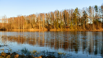 Wall Mural - spring landscape with reflections of lakes, clouds and trees on a calm water surface