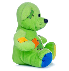 Green small soft toy bear on white background isolation