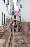 Fototapeta  - Narrow old stone street in Cusco, Peru.