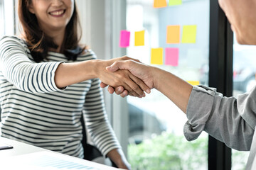 Aufkleber - Businessman shaking hands with businesswoman after discussing good deal of Trading contract and new project