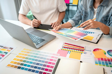 Poster - Team of creative graphic designer working on color swatch samples chart for selection coloring in inspiration to create new collection at workplace