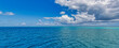 canvas print picture Beautiful sky and blue sea. Idyllic nature panoramic seascape, ocean lagoon dreamy cloudy sunny tropical sea view. Amazing nature panorama. Summer seaside, beach waves. Peaceful, tranquil surf 