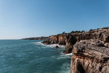 Amazing Views Of The Ocean With Waves And Cliffs In Portugal. Summer Vacation And Travel
