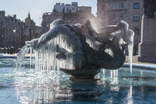 Frozen Fountain Statues Of Trafalgar Square In London. Icicles Mystically Hanging Off Bronze Water Fountain