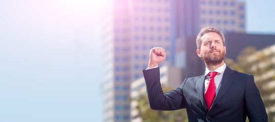 successful businessman in suit standing outdoor, business. man face portrait, banner with copy space