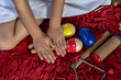 © Amilciar - Hands of Latin American girl in her music class with her percussion instruments.