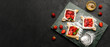 Composition with sweet strawberry puff pastries on dark background with space for text