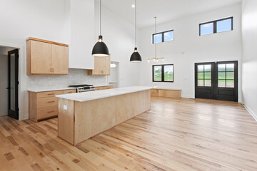 Wall Mural - large empty kitchen with black windows and natural finished hardwood flooring