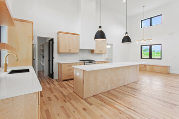 Wall Mural - large empty kitchen with black windows and natural finished hardwood flooring