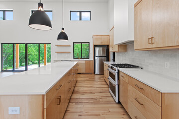 Wall Mural - large empty kitchen with black windows and natural finished hardwood flooring